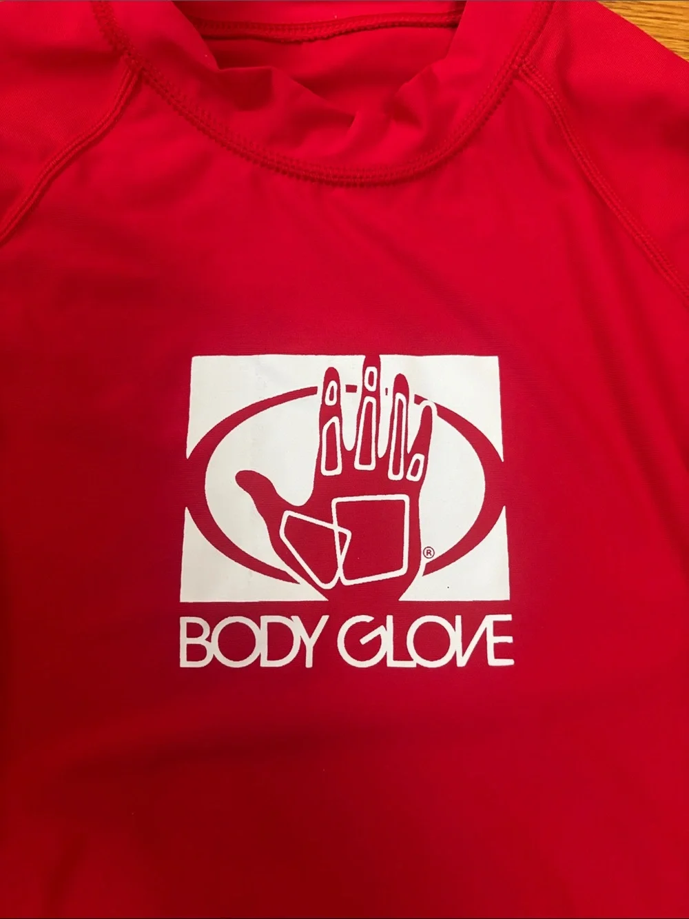 Body Glove blue and red rash guard tops